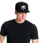 Zdjęcie produktu Wiedźmin - Czapka Snapback z wilczym medalionem czarna