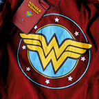 Zdjęcie produktu Wonder Woman - Skórzana kurtka z logo i kapturem, niebieska