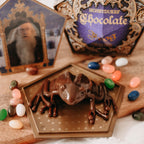 Zdjęcie produktu Figurka czekoladowej żaby z kartą kolekcjonerską - replika z Harry'ego Pottera