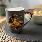 Zdjęcie produktu Kubek z logo Hufflepuff szary - Harry Potter