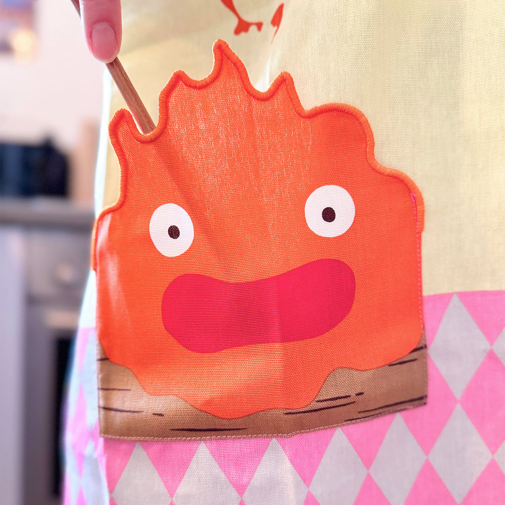 Zdjęcie produktu Ruchomy zamek Hauru – Fartuch Calcifer