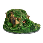 Zdjęcie produktu Władca Pierścieni - Świecznik na podgrzewacze diorama Nory Hobbita (Shire)